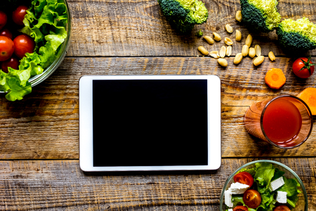concept diet and tablet with vegetables mock upの写真素材