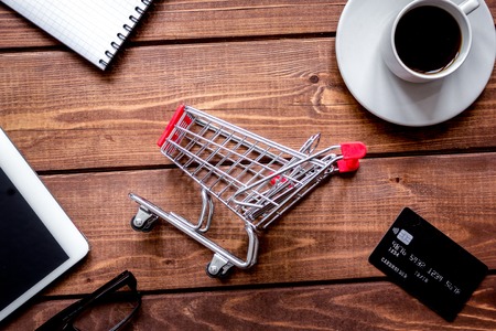 Concept online shopping with smartphone on wooden backgroundの写真素材