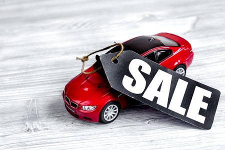 concept of selling cars on wooden background close upの写真素材