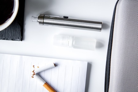 concept of electronic cigarette on white background top view.の写真素材