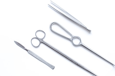 instruments for plastic surgery on white background top view.の写真素材
