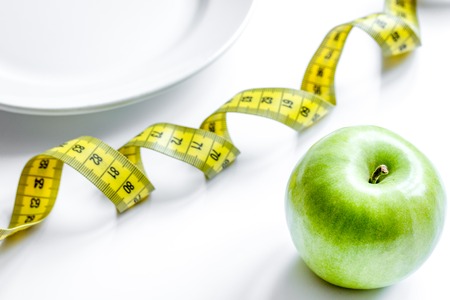Concept diet and weight loss on white background top view.の写真素材