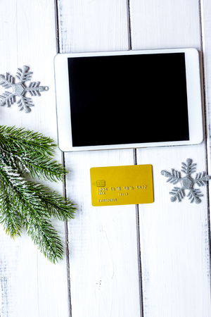 online shopping christmas with e-tablet wooden background top viの写真素材