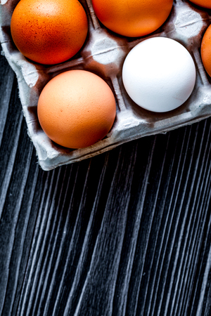 concept of correct choice eggs on wooden background top viewの写真素材