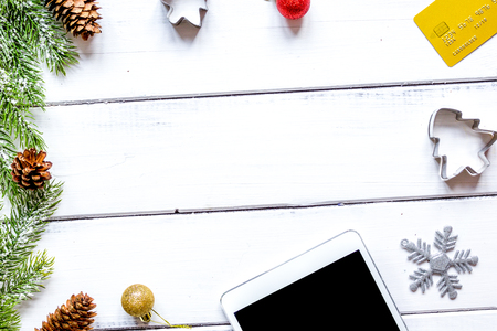 online shopping christmas with e-tablet at wooden background top viewの写真素材