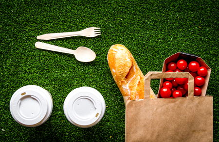 take out in paper bag on green background top viewの写真素材