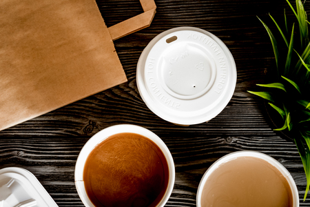 coffee break at dark wooden background top viewの写真素材