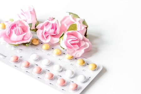 concept of female contraception on white backgroundの写真素材