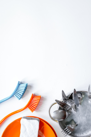 concept of washing dishes on white background top viewの写真素材