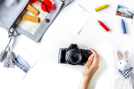 children tourism outfit with toys and camera on white backgroundの写真素材