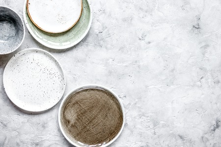 ceramic tableware top view on stone background mock upの写真素材