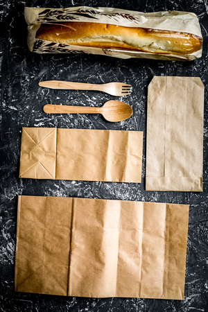 delivery set with paper bags and sandwich on gray background topの写真素材