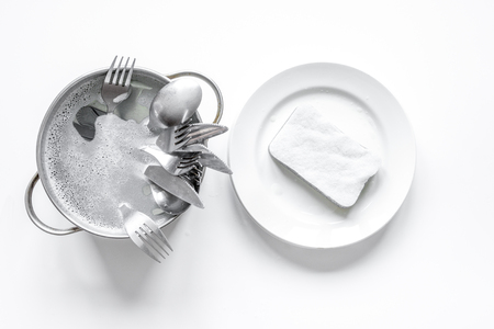 concept of washing dishes on white background top viewの写真素材