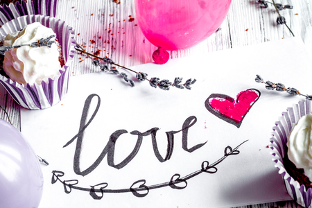concept of Valentines Day cupcakes wooden background close upの写真素材