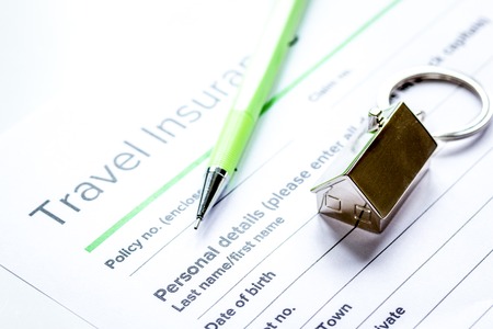 Traveling concept with insurance application on white table