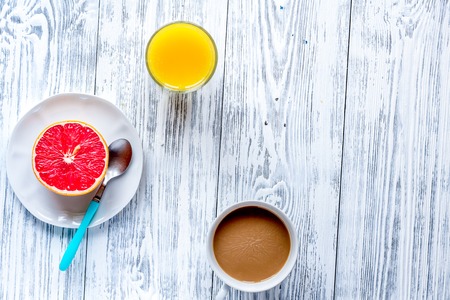 Breakfast concept with flowers on wooden  top viewの写真素材