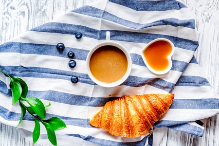 Breakfast concept with flowers on wooden  top viewの写真素材