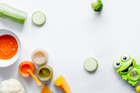 cooking vegetable puree for baby on white background top viewの写真素材