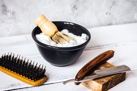Wooden desktop with tools for shaving beardsの写真素材