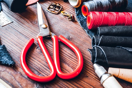 Cobbler tools in workshop on wooden  mock up.
