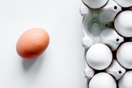 concept of correct choice eggs on white background top view