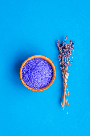 aroma therapy with lavender flower fragrance and spa salt on blue  top view space for textの写真素材