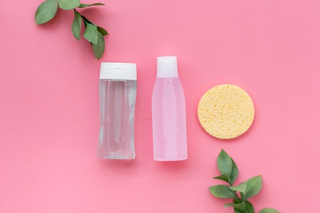 Organic cosmetics for face clearing with sponge, facial tonic and mycelial water on pink background top view copy spaceの写真素材