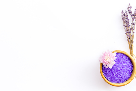 purple spa salt for aroma therapy with lavender flower fragrance on white background top view copyspaceの写真素材