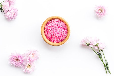 aroma therapy with pink flower fragrance and spa salt on white background top viewの写真素材