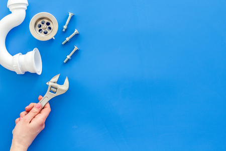 Plumber work with instruments, tools and gear on blue background top view mockupの写真素材