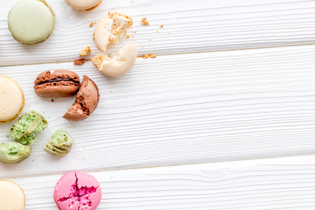 Macarons design on white wooden background top view space for textの写真素材