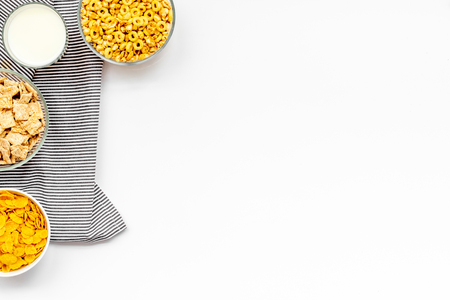 Cereals and flakes from corn and oat on white background top view mockupの写真素材