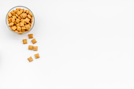 Puffins, cereals in bowls on white background top view space for textの写真素材