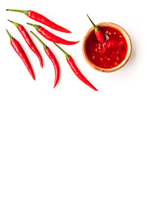 Fresh red chilli pepper as food ingredient on white table  top view mockupの写真素材