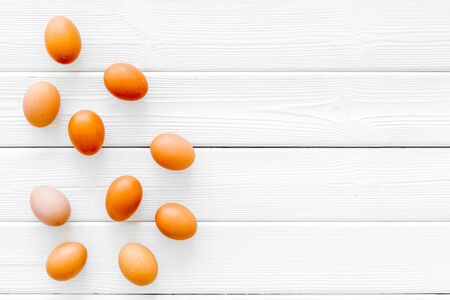 Healthy food. Farm products with eggs on white wooden background top view mock upの写真素材
