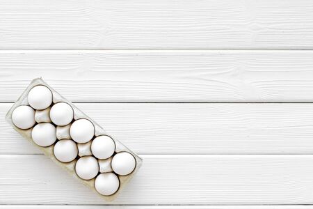 Healthy food. Farm products design for blog with eggs on white wooden background top view space for...