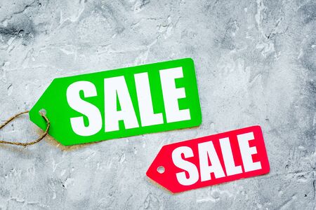 Christmas sales on gray background top view.