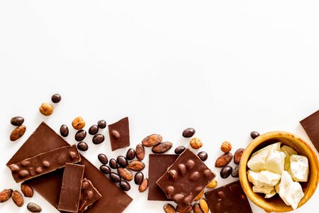Cook homemade chocolate with bars, nuts, coffee beans on white top view mock up