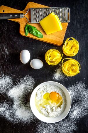 Cooking process of pasta on darkの写真素材