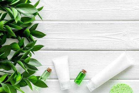 skin care with natural organic cosmetics with herbal extract on white wooden background top view mockupの写真素材