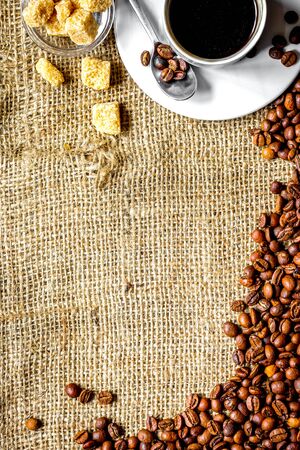 coffee beans, coffe cup on linen cloth background top viewの写真素材