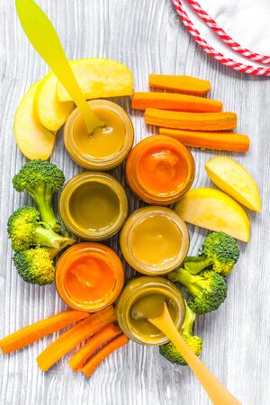 baby vegetable puree on wooden background top viewの写真素材