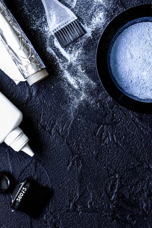 hair dye with brush on dark background top viewの写真素材