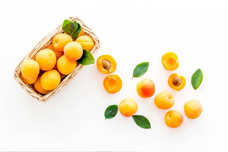 Collect apricots, white background top view copy space, pattern with leavesの写真素材