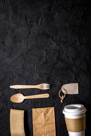 breakfast take away with paper bags on dark restourant table background top view mock upの写真素材