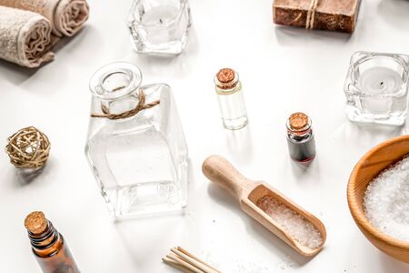 spa composition for body care with sea salt on white table background