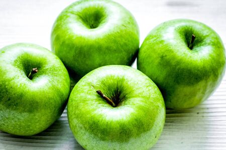 Healthy green food with apples on kitchen white backgroundの写真素材