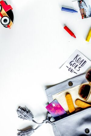 children tourism outfit with toys on white desk background flat lay mockupの写真素材
