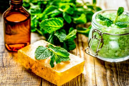 organic cosmetics with herbal extracts of mint on wooden backgroundの写真素材