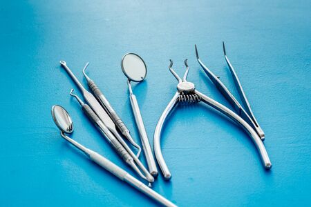 Dental instruments - set with mirrors - on blue background close upの写真素材